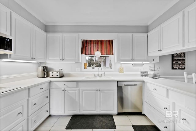 kitchen featuring light tile patterned floors, dishwasher, light countertops, white cabinetry, and a sink