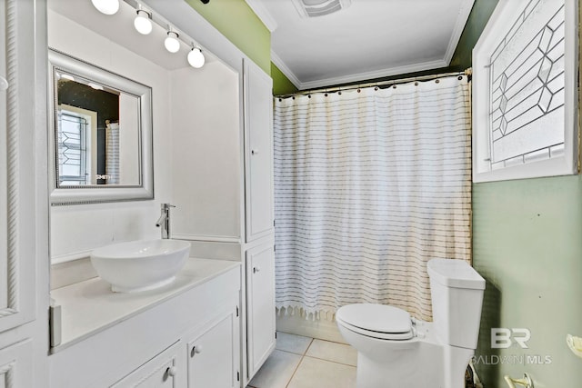 bathroom featuring visible vents, toilet, tile patterned flooring, crown molding, and vanity