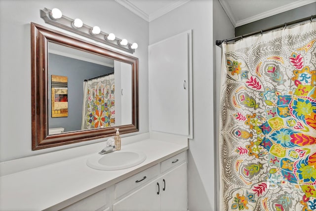 full bath with ornamental molding and vanity