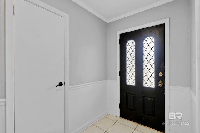 entryway featuring crown molding and light tile patterned floors