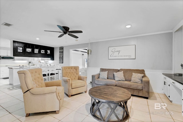 living room with ceiling fan, light tile patterned flooring, recessed lighting, visible vents, and ornamental molding