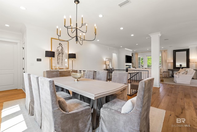 452 Colony Dr, Fairhope, AL 36532 - dining room featuring recessed lighting, ornate columns, visible vents, a chandelier, and light wood-style flooring