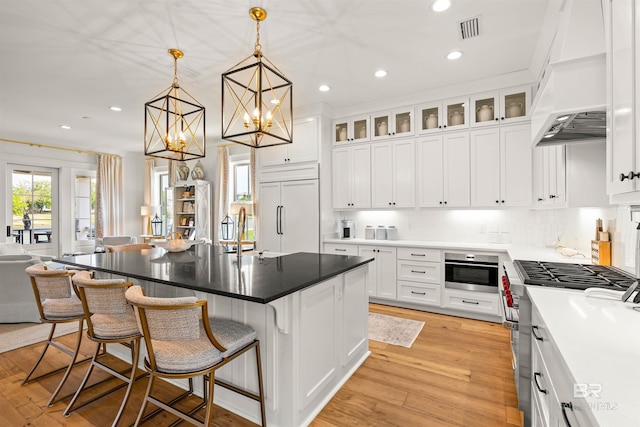 452 Colony Dr, Fairhope, AL 36532 - kitchen featuring recessed lighting, high end appliances, visible vents, a sink, and white cabinetry