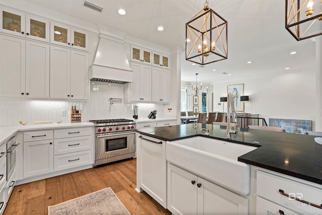 452 Colony Dr, Fairhope, AL 36532 - kitchen featuring an inviting chandelier, dishwasher, a sink, premium range hood, and designer stove