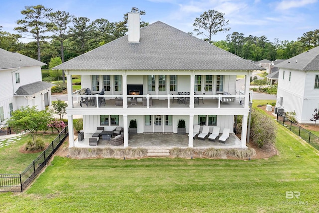 452 Colony Dr, Fairhope, AL 36532 - back of house featuring a yard, a shingled roof, a fenced backyard, and an outdoor living space