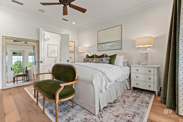 452 Colony Dr, Fairhope, AL 36532 - bedroom featuring light wood-style floors, visible vents, crown molding, and ceiling fan