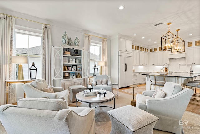 452 Colony Dr, Fairhope, AL 36532 - living area featuring recessed lighting, light wood-style flooring, visible vents, and a notable chandelier