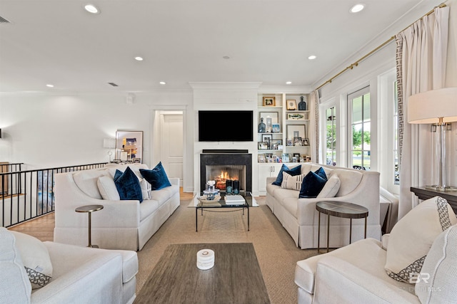 452 Colony Dr, Fairhope, AL 36532 - living area with a warm lit fireplace, recessed lighting, and ornamental molding