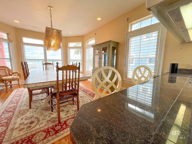 2210 W Beach Blvd, Gulf Shores, AL 36542 - dining room with light wood finished floors, a notable chandelier, and recessed lighting