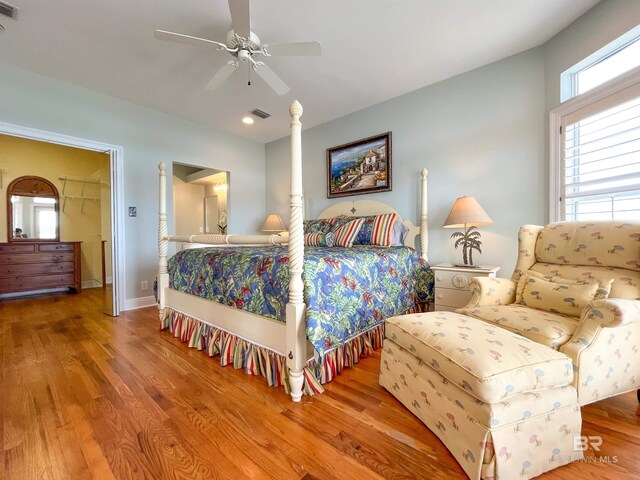 2210 W Beach Blvd, Gulf Shores, AL 36542 - bedroom with visible vents, wood finished floors, and ceiling fan