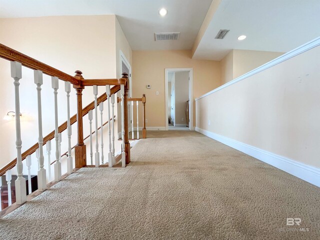 2210 W Beach Blvd, Gulf Shores, AL 36542 - hallway featuring recessed lighting, baseboards, light colored carpet, and visible vents