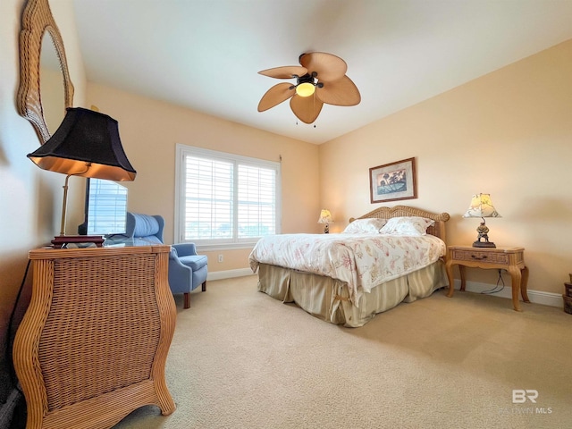 2210 W Beach Blvd, Gulf Shores, AL 36542 - carpeted bedroom with baseboards and a ceiling fan