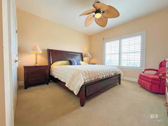2210 W Beach Blvd, Gulf Shores, AL 36542 - carpeted bedroom featuring baseboards and a ceiling fan