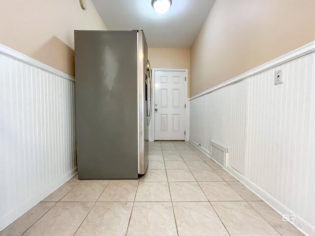 2210 W Beach Blvd, Gulf Shores, AL 36542 - hall with light tile patterned flooring, visible vents, and wainscoting