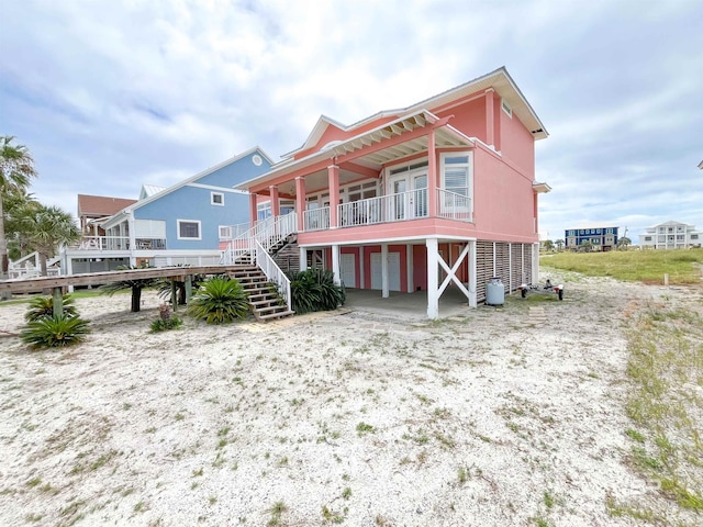 2210 W Beach Blvd, Gulf Shores, AL 36542 - back of property with stairs