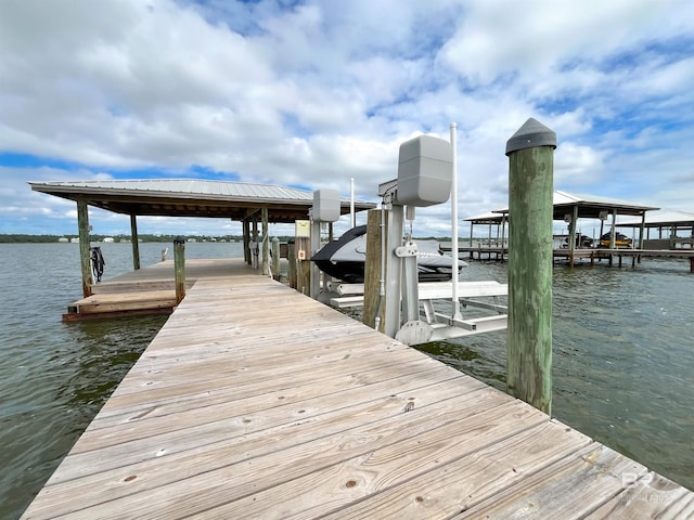 2210 W Beach Blvd, Gulf Shores, AL 36542 - view of dock with boat lift and a water view