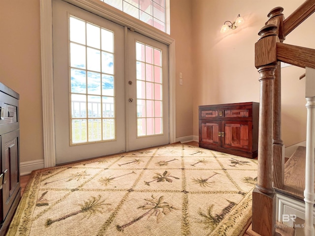 2210 W Beach Blvd, Gulf Shores, AL 36542 - doorway to outside featuring baseboards and stairs