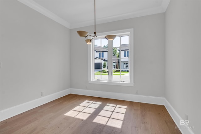 926 Inlet Cir, Gulf Shores, AL 36542 - empty room with wood finished floors, a chandelier, and ornamental molding