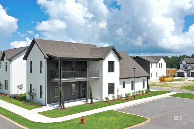 926 Inlet Cir, Gulf Shores, AL 36542 - view of building exterior with a residential view and uncovered parking