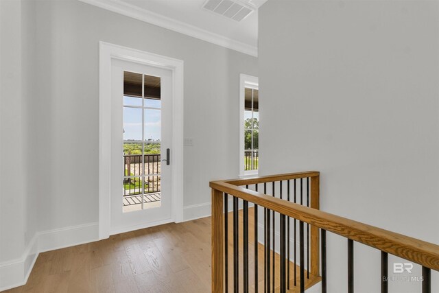 926 Inlet Cir, Gulf Shores, AL 36542 - corridor featuring an upstairs landing, crown molding, and wood finished floors