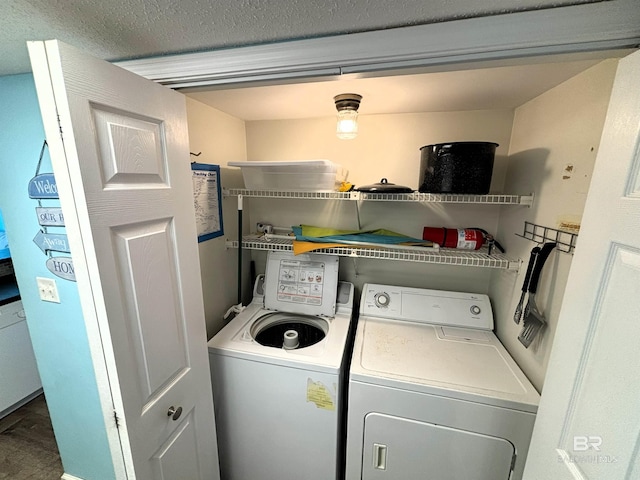 clothes washing area featuring washing machine and clothes dryer