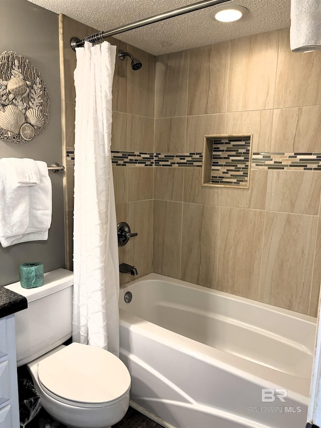 full bathroom with shower / tub combo with curtain, vanity, a textured ceiling, and toilet