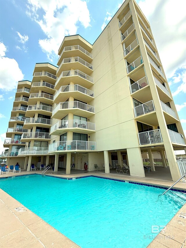505 E Beach Blvd Unit 5-C, Gulf Shores, AL 36542 - pool featuring fence, a water view, and a patio