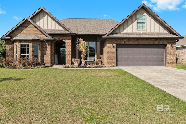 view of front facade with brick siding, driveway, and a front yard