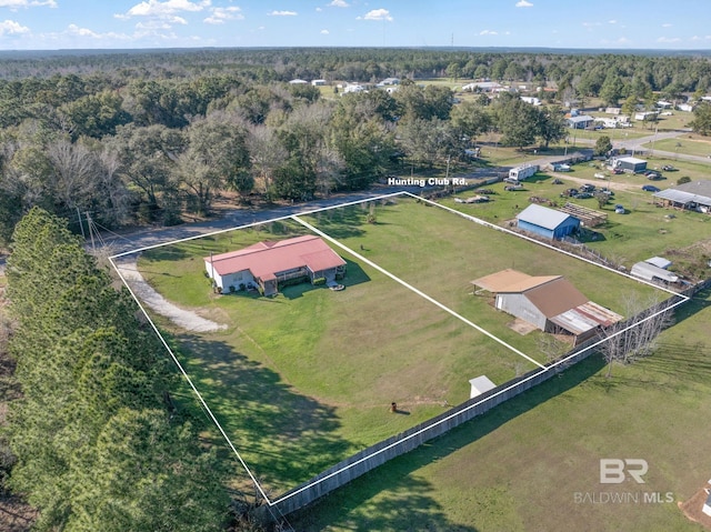 aerial view featuring a wooded view