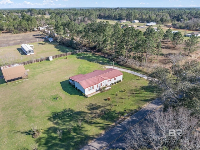 birds eye view of property featuring a rural view