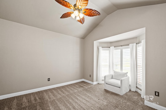 unfurnished room featuring carpet floors, vaulted ceiling, and ceiling fan