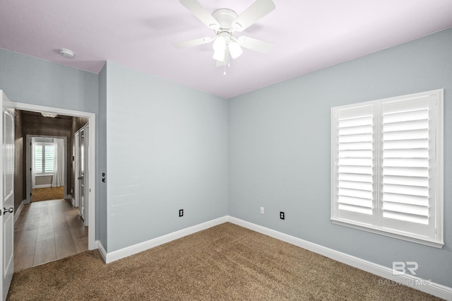 unfurnished room featuring carpet floors and ceiling fan