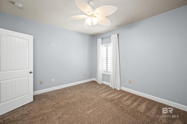 empty room featuring ceiling fan and carpet floors