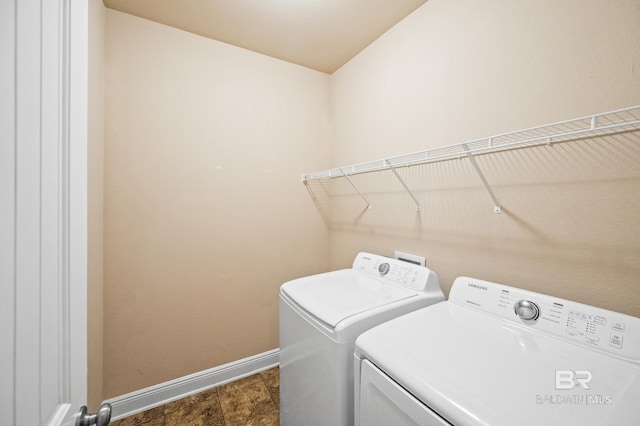 washroom featuring washer and clothes dryer