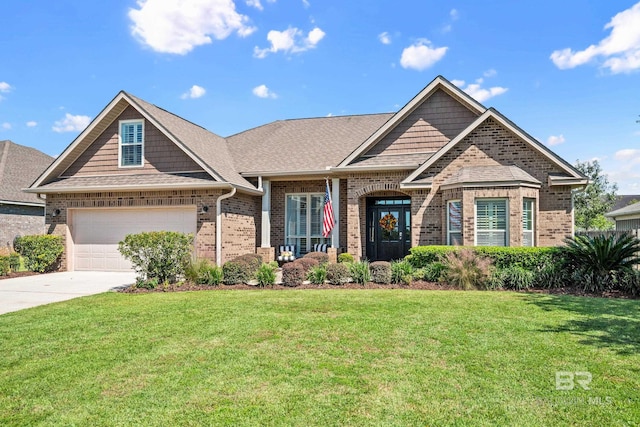 craftsman inspired home with a garage and a front yard