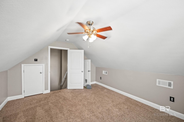 bonus room with carpet, lofted ceiling, and ceiling fan