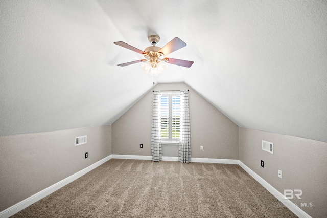 bonus room with carpet, vaulted ceiling, and ceiling fan