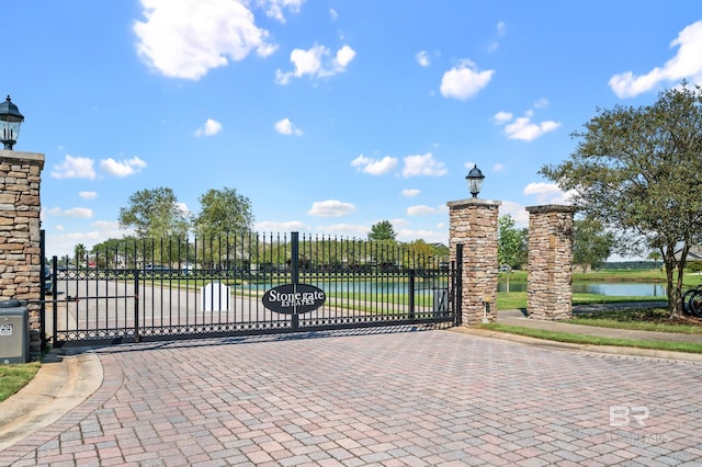 view of gate featuring a water view