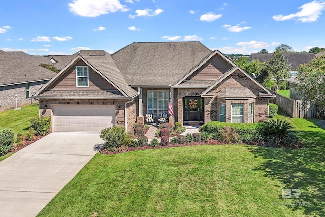 craftsman-style house featuring a garage and a front yard