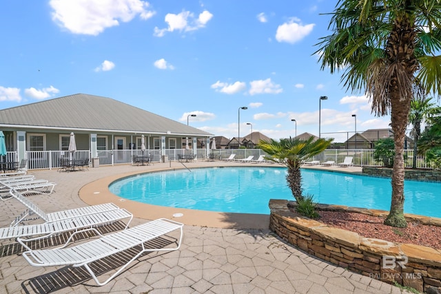 view of swimming pool with a patio area