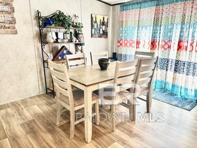 dining space featuring wood-type flooring