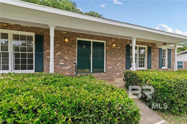 entrance to property featuring a porch