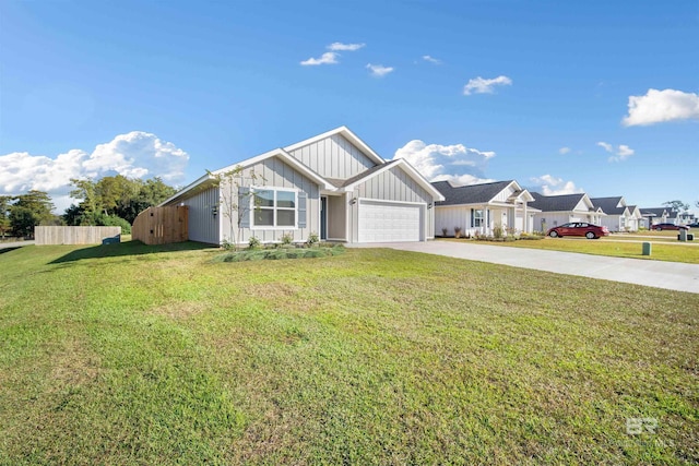 view of front of home featuring a front yard and a garage