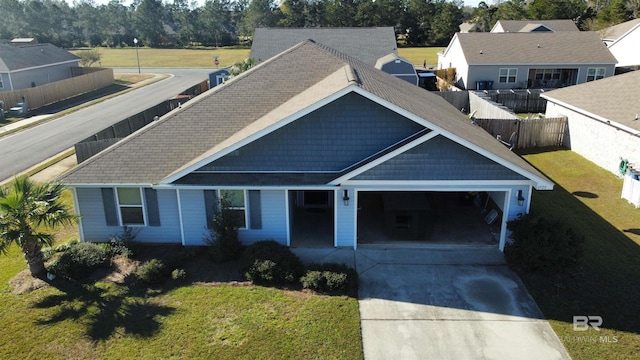 6923 Crimson Ridge St, Gulf Shores, AL 36542 - view of front of property with a garage and a front lawn