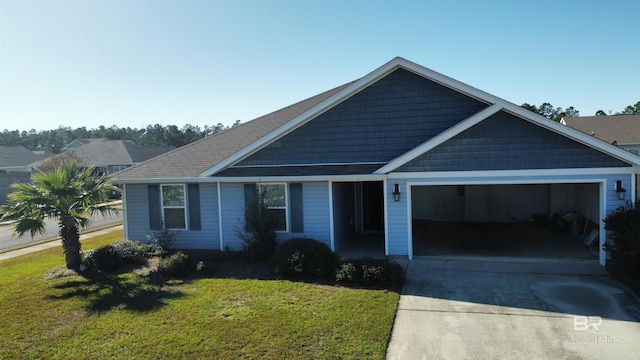 view of front of property featuring a garage and a front lawn