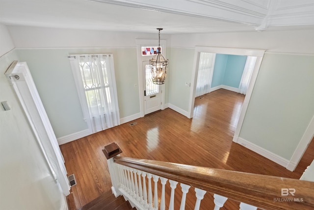 1206 Palmetto St, Mobile, AL 36604 - entryway with wood finished floors, baseboards, and a chandelier