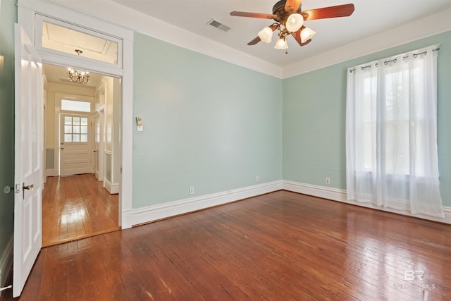 1206 Palmetto St, Mobile, AL 36604 - unfurnished room with hardwood / wood-style floors, a chandelier, a ceiling fan, and baseboards
