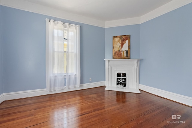 1206 Palmetto St, Mobile, AL 36604 - unfurnished living room with wood finished floors, a fireplace with flush hearth, and baseboards