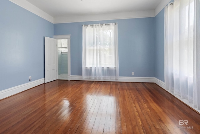 1206 Palmetto St, Mobile, AL 36604 - spare room featuring hardwood / wood-style flooring and baseboards