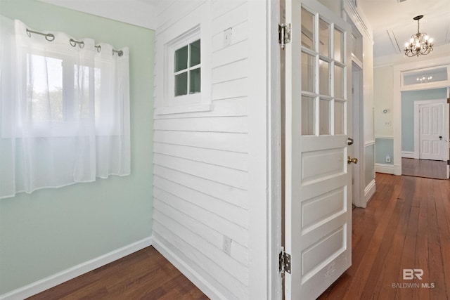 1206 Palmetto St, Mobile, AL 36604 - hallway with a chandelier, dark wood-style flooring, and baseboards